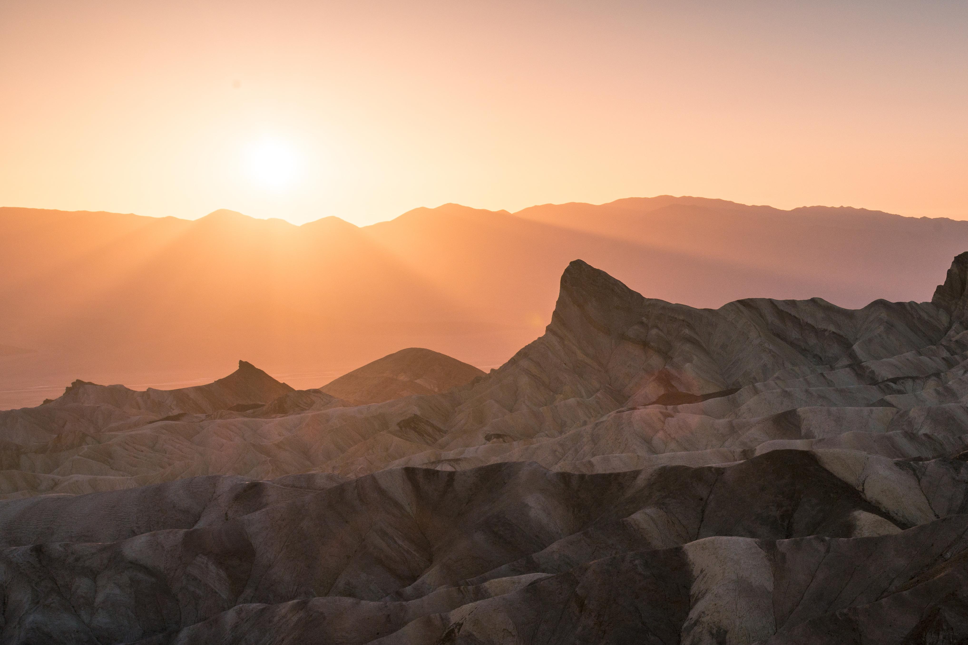 Sunrise light on the eroded badlands of Zabriskie Point in Death Valley National Park