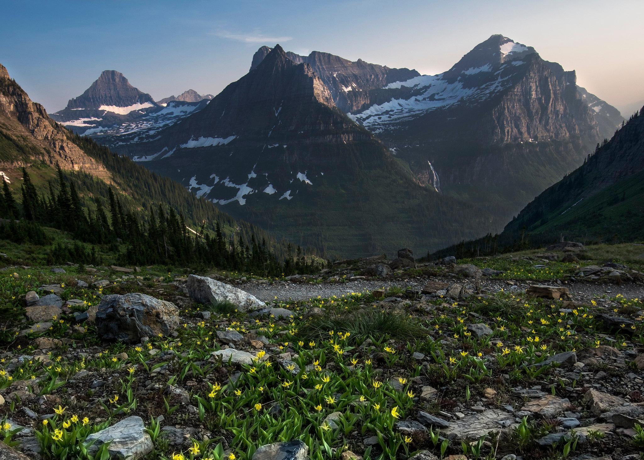 Turquoise lake below rugged peaks along Going-to-the-Sun Road in Glacier National Park, Montana