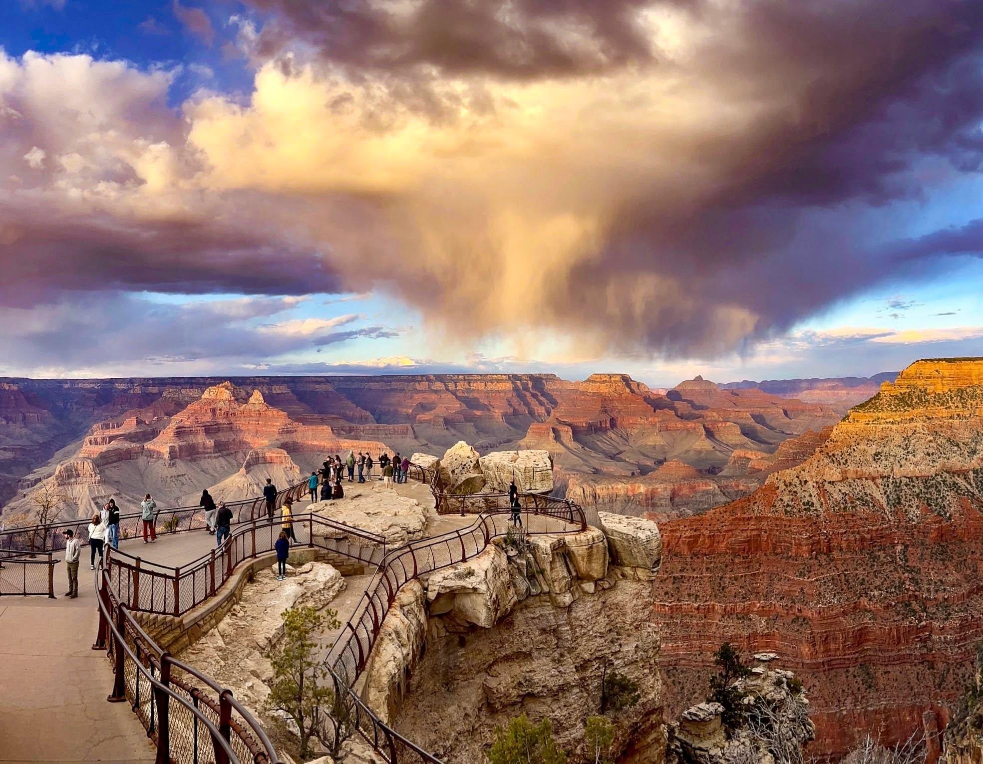 Grand Canyon at sunset with swirling rain clouds