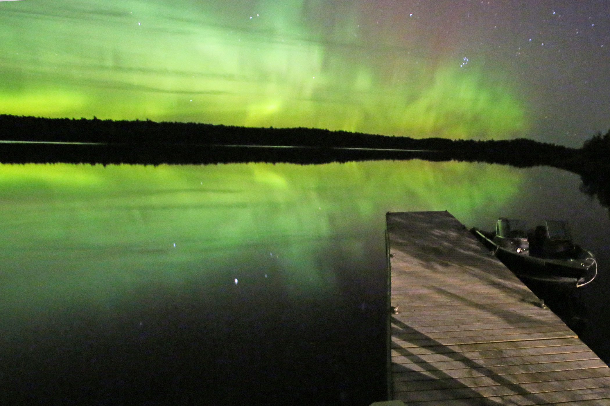 Boats on a forested lake at Voyageurs National Park, Minnesota